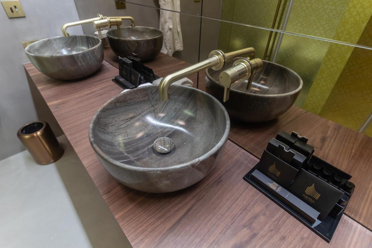 The Veil Hotel Astana Buitenkant foto Bathroom sinks